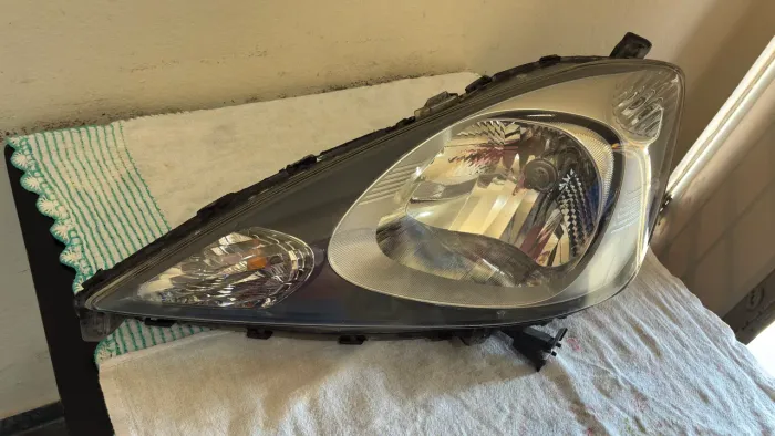 Par de farol Honda new fit 09/13 Original
