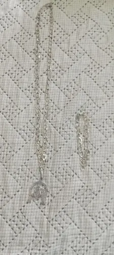 Cordão de prata, pulseira, pingente