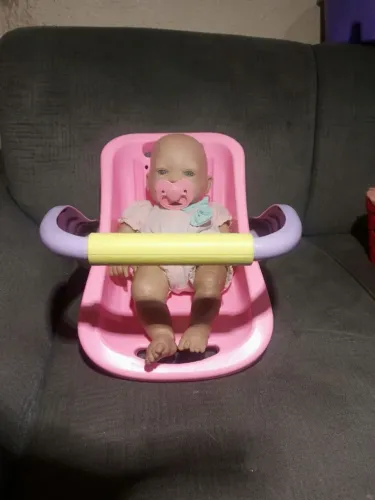 Boneca com bebê conforto