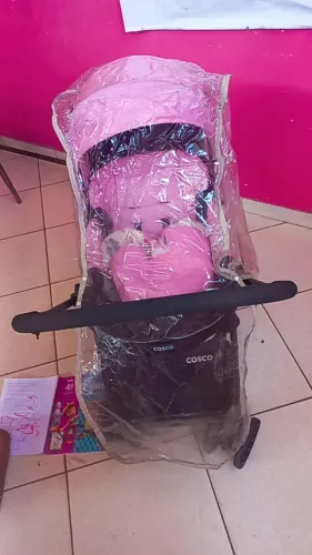 carrinho rosa reverse cosco + almofada + capa de chuva