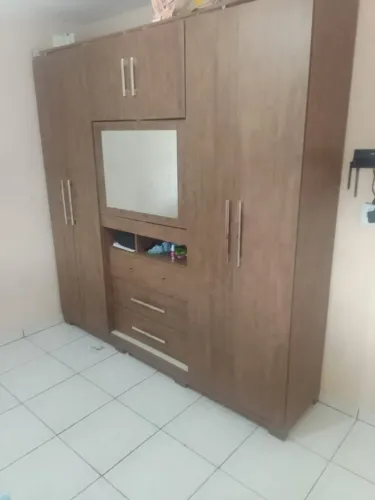 Guarda-Roupas com Painel Central Giratório - 6 Portas e 3 Gavetas Usado