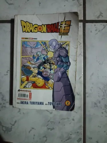 Vendo o volume 2 do manga de dragon ball super, desgastado mais com todas as páginas
