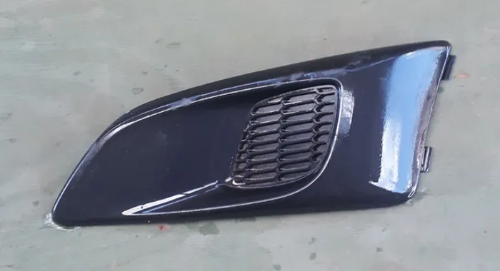 Moldura farol de milha sonic lado esquerdo 