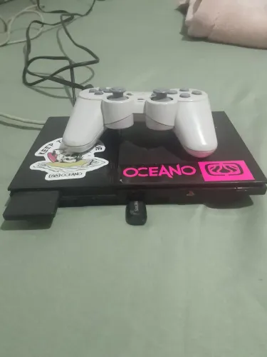 PS2 com pen drive com 6 jogos e 1 controle branco. Falo os jogos no chat