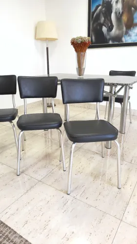 Conjunto de seis cadeiras em aço inox e couro