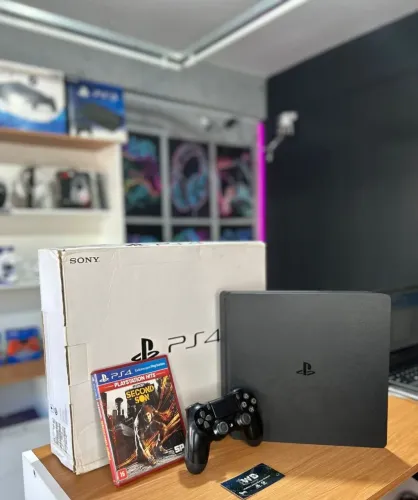 PS4 slim + jogo de brinde 1tb semi-novo com garantia.