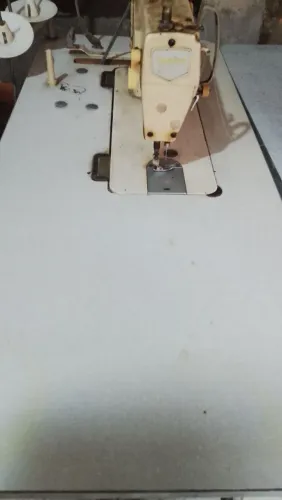 Máquina de costura...
