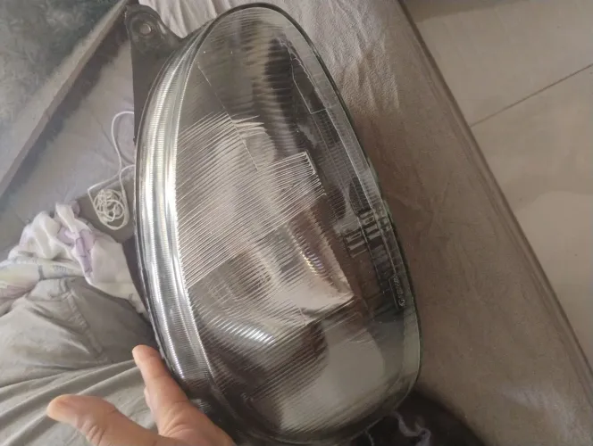 Farol do Corsa mascara mega original