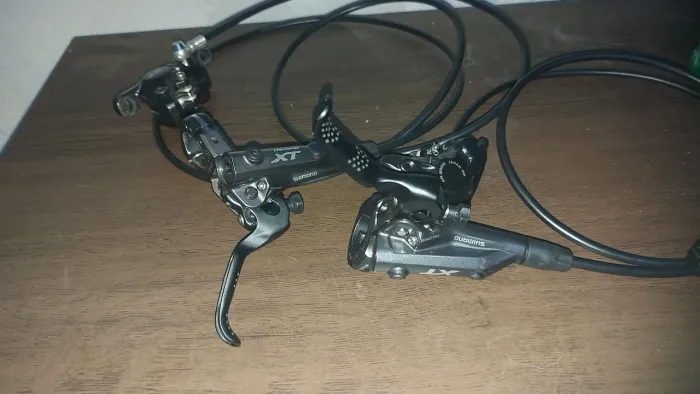 Vendo ou troco freio deore XT o par com sangria e pastilha nova já!!!