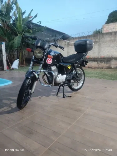 Titan conservada, freio a disco, rodas de liga,  mata cachorro e suporte para celular.