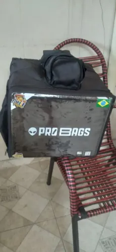 Vendo bag, capa de chuva e bota