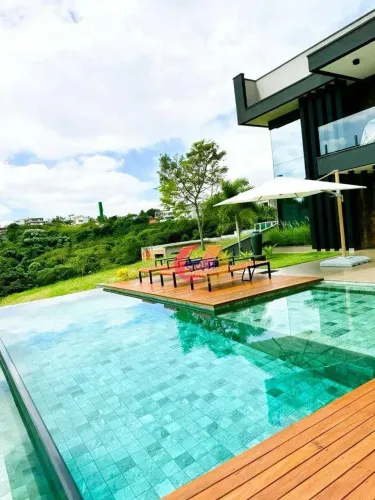 Casa com 4 dormitórios à venda, 375 m² por R$ 4.030.000,00 - Condomínio Reserva Ibirapitan