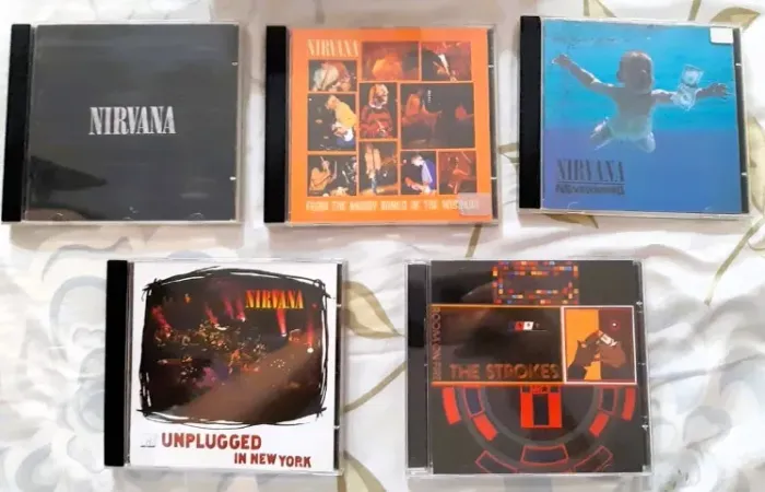 CD's NIRVANA & THE STROKES / COLECIONADOR