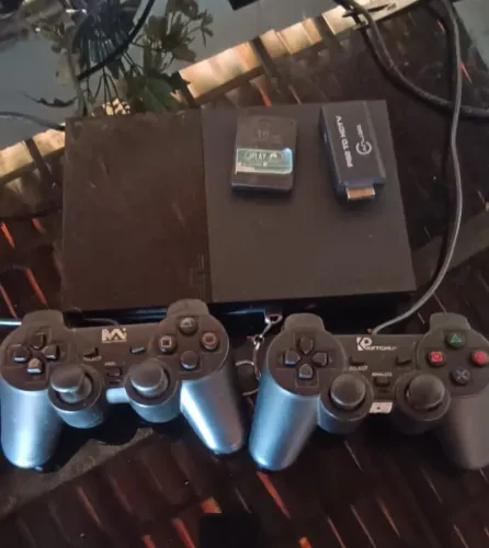 Ps2 slim + 2 controles + 1 memory card e diversos jogos