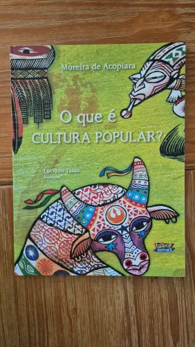 Livro infantil: O que é cultura popular? Esta seminovo impecável.