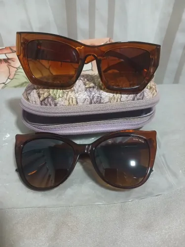 Óculos de sol novos e relógio 40 reais