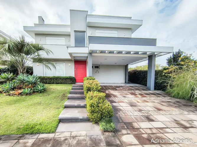 ALPHAVILLE PORTO ALEGRE | CASA COM FUNDOS PARA APP E ÁREA EXTERNA COMPLETA