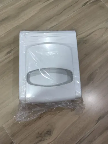 Dispenser para protetor de assento sanitário
