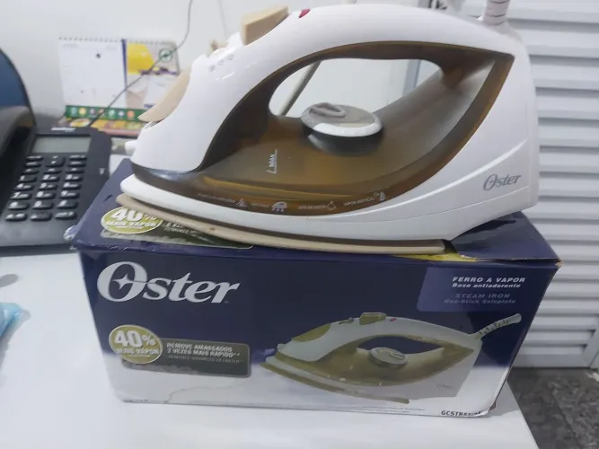 Ferro de passa roupa oster