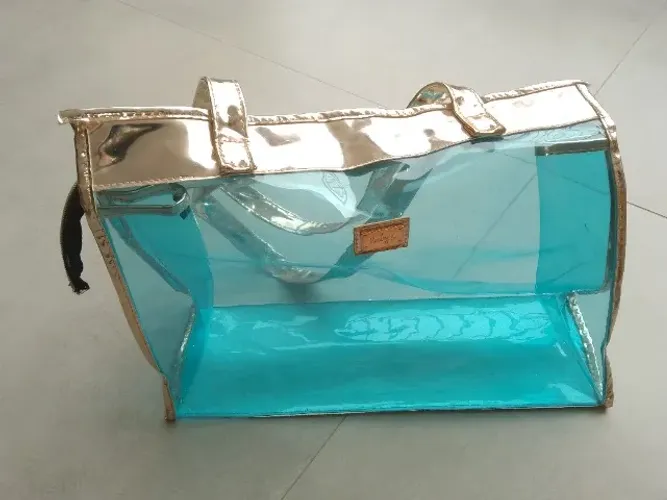 Bolsa de praia ruby's transparente azul com dourado rose usada