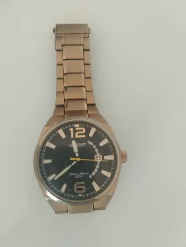 Relógio orient dourado semi novo