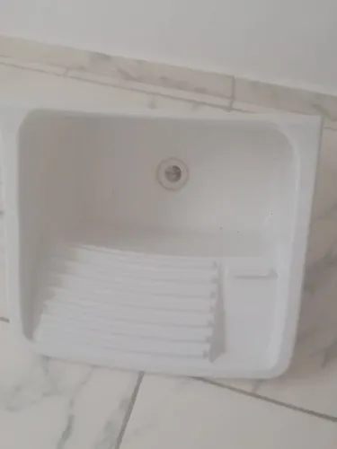 Uma pia de lava roupa nova cuida chama na nota deixo na sua casa