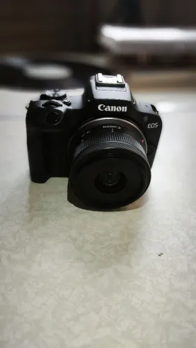 Câmera Canon r100 + lente kit 18-45 + 2 baterias