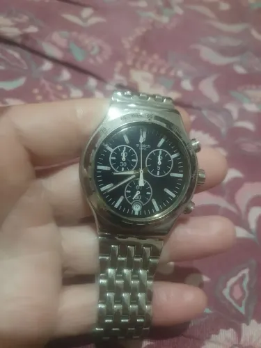 Swatch funcionando perfeitamente todo em aço inox