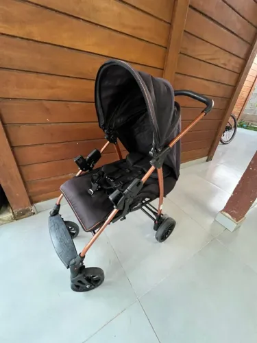 Carrinho de bebê Burigotto preto/cobre