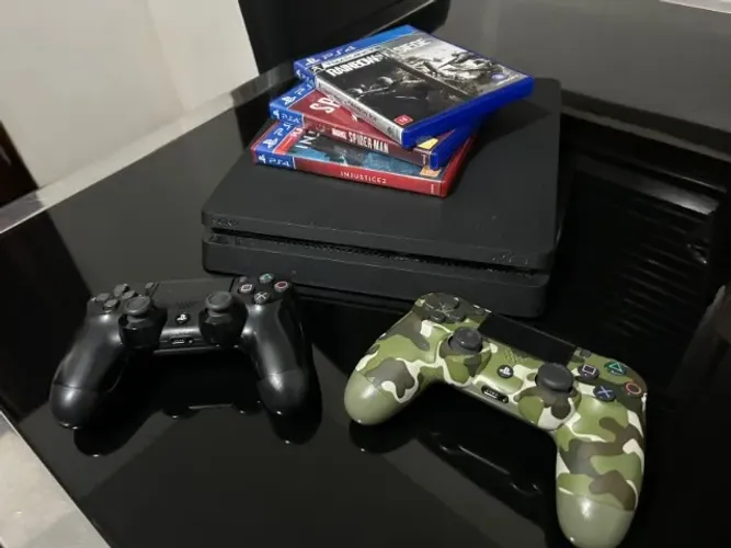 Vendo PS4 slim 500gb, seminovo em perfeito estado de funcionamento