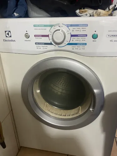 Máquina de secar com defeito
