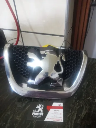 Símbolo para-choque Peugeot 207