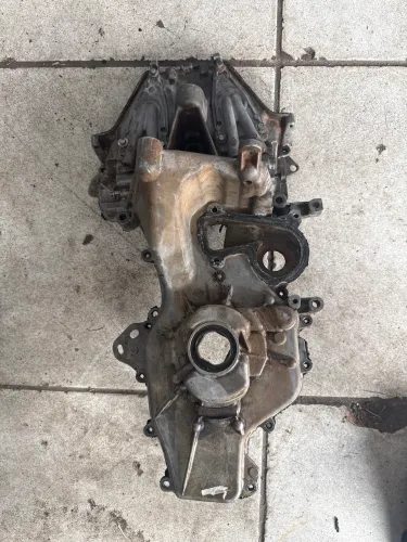 Tampa lateral motor sandero/ logan 3 cilindros 