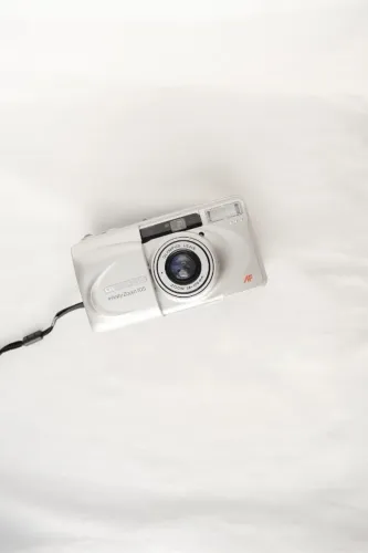 Olympus Infinity Zoom 105 (caixa original) + pilha CR123A (câmera analógica)