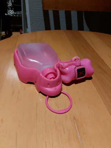 Bebedouro portátil rosa e porta saquinho pet