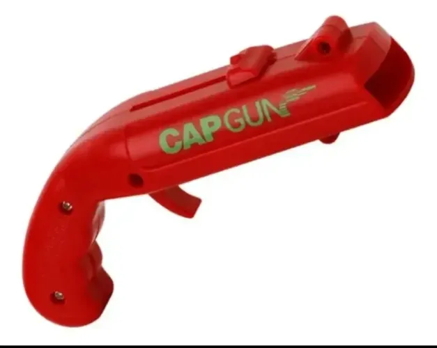 Abridor Lança-Tampinhas Cap Gun!