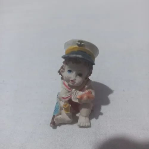 Bebê de resina para enfeie