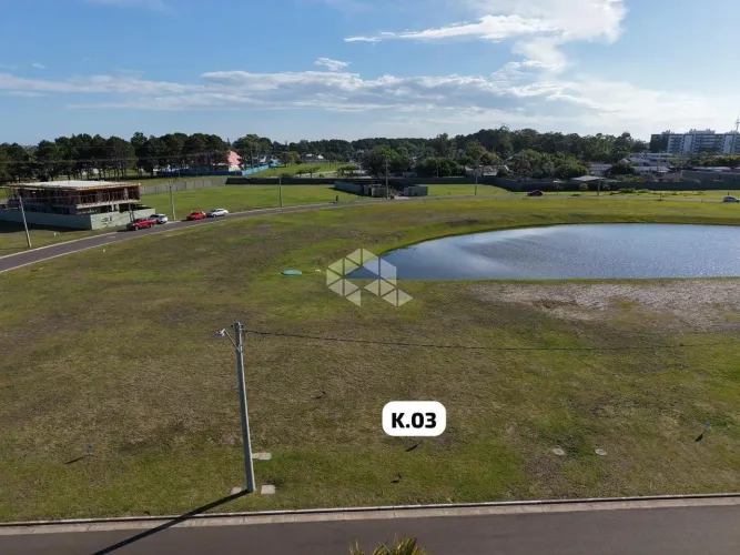 Terreno no condomínio Lotus Atlântida beira lago