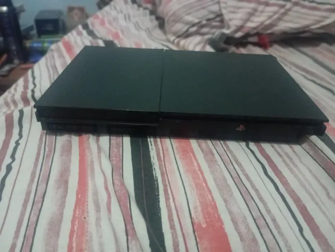 Playstation 2 completo com controle e jogos e volante para melhorar a game play