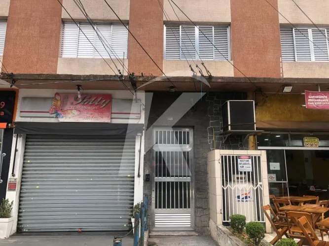 Apartamento com 2 quartos, sala, cozinha, banheiro e área de serviço.