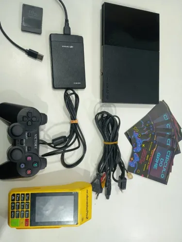 Playstation 2 slim com leitor funcionando e HD lotado de jogos.