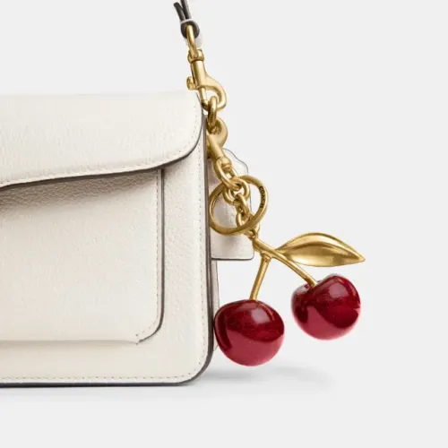 chaveiro coach cereja dourado