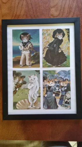 Quadro com imagens de gatos.