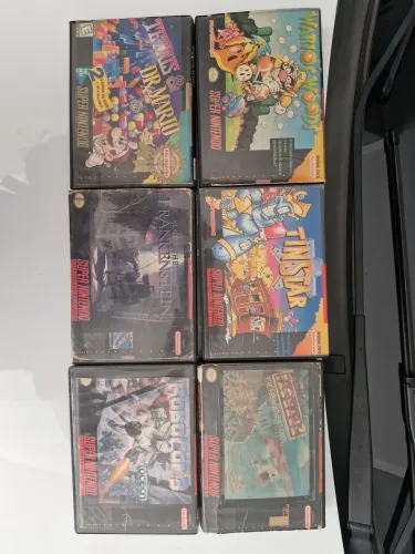 Cartuchos originais de super nintendo na caixa
