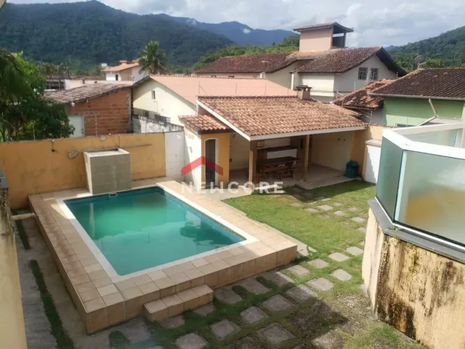 Casa de condomínio em Rua Caúna - Martim de Sá - Caraguatatuba/SP