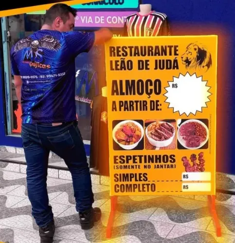 GRÁFICA EM LONA E ADESIVO IMPRESSSO