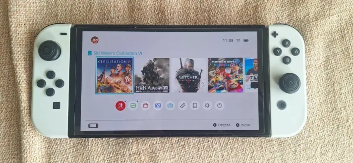 Nintendo Switch OLED Branco + 9 Jogos (Civilization VI, Witcher 3, Hades II + Case e Kit)