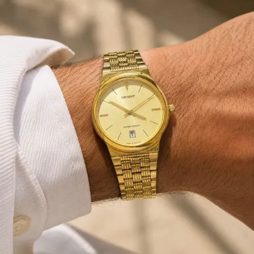 Relógio orient anos 80 dourado