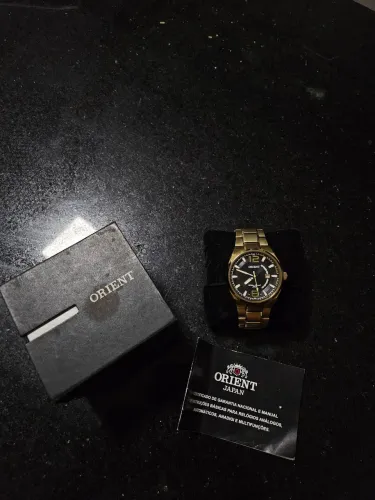 relógio ORIENT dourado