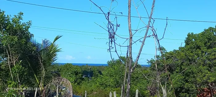 Vendo terreno com vista pro mar 2km da praia .